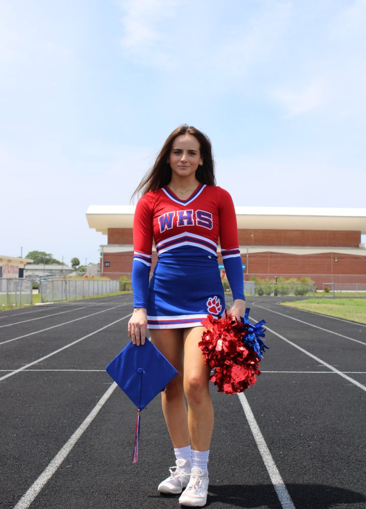 cheerleader with graduation cap